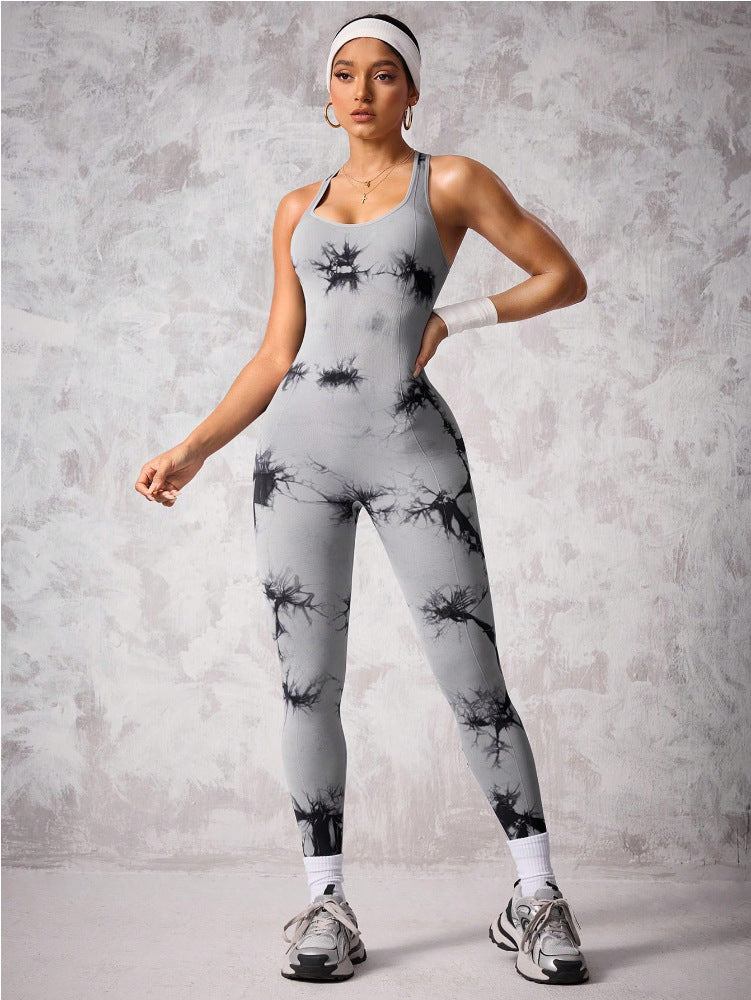 Side profile of woman in tight nylon workout jumpsuit – breathable gymwear with stylish cutout back.”